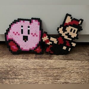 Nintendo Pixel Art with Pink and Red Characters Kirby Mario Tanuki